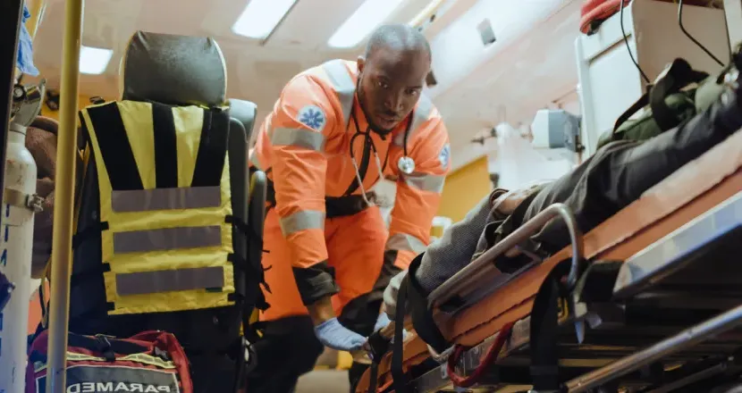 EMT Emergency Medical Technician Loading Patient Into Ambulance