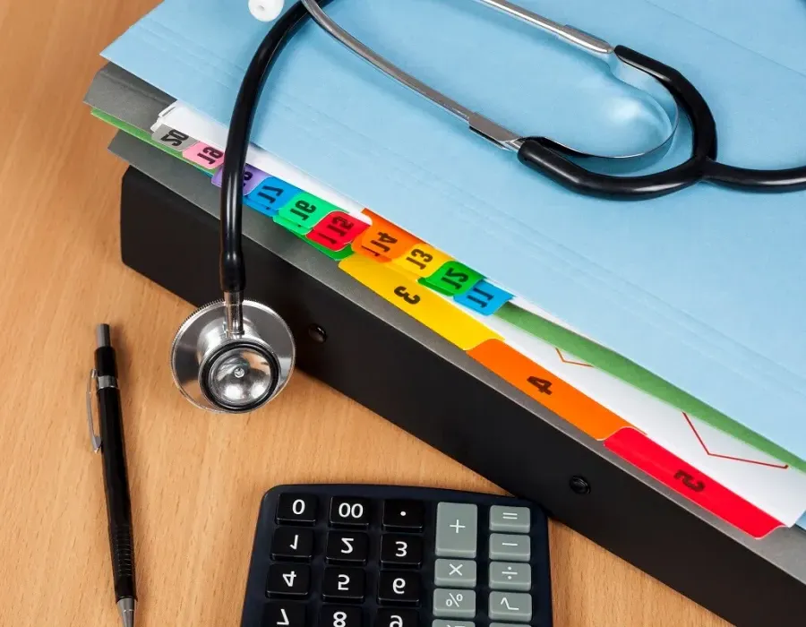 File folder on desk with stethoscope resting on top